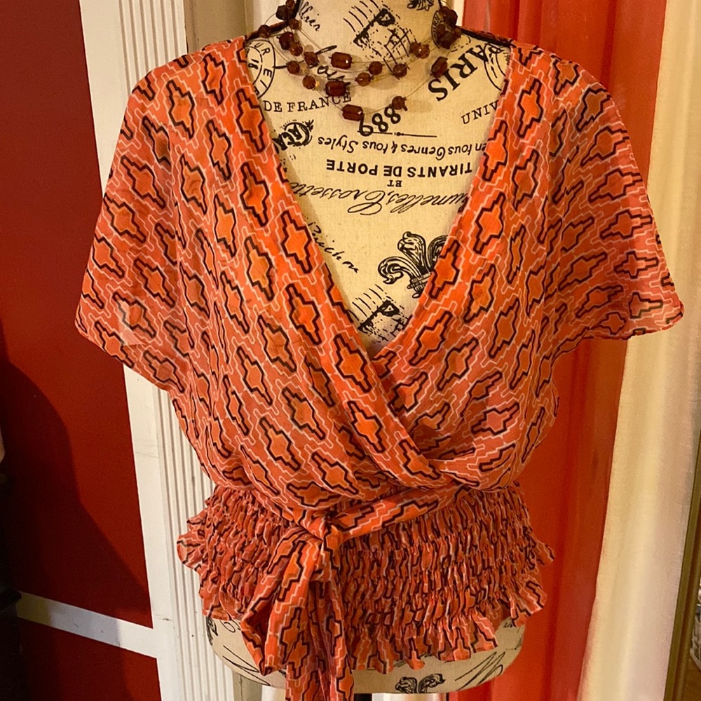 Small Worthington blouse with a belt comes with hoop for the belt short sleeve .